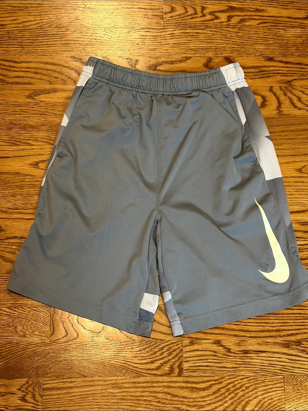Nike Youth Gray Athletic Shorts with Yellow Swoosh